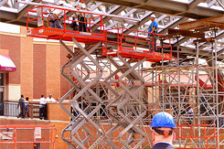 Construction Workers In Scaffolding
